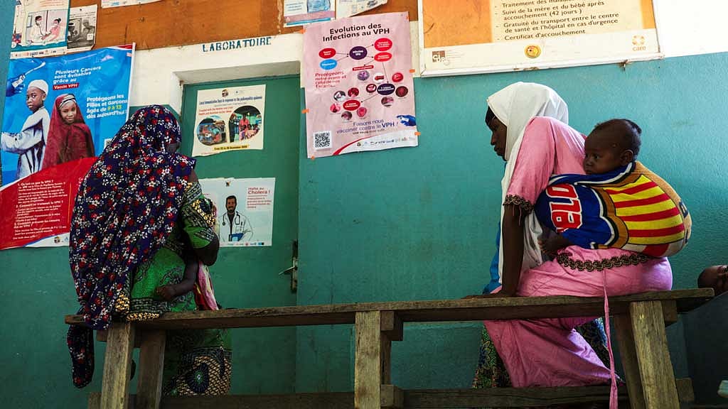 Women sit as they wait for medical consultation at a Health Center, in Bogo Cameroon Sept 2, 2025. REUTERS/Desire Danga Essigue