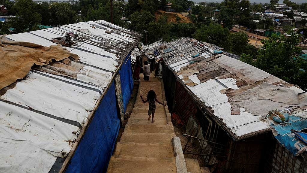A Rohingya refugee child runs down the stairs of a refugee camp in Cox's Bazar, Bangladesh, Aug 27, 2025. REUTERS/Mohammad Ponir Hossain