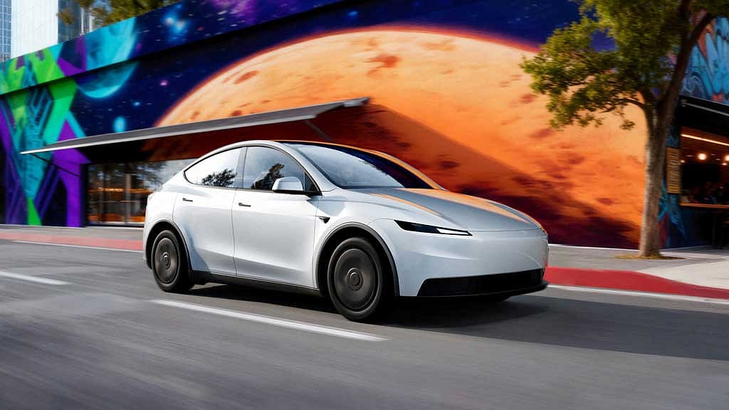 Tesla profit falls short despite record sales