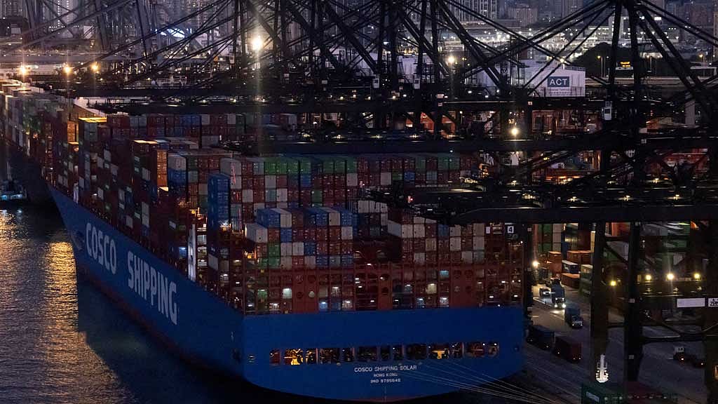 FILE PHOTO: A general view of the container terminals and a Cosco Shipping vessel at Kwai Chung district in Hong Kong, China Nov 28, 2024. REUTERS/Tyrone Siu/File Photo