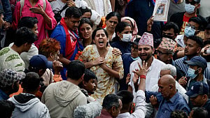 Weeping Nepalis hold funerals for dead anti-graft protesters