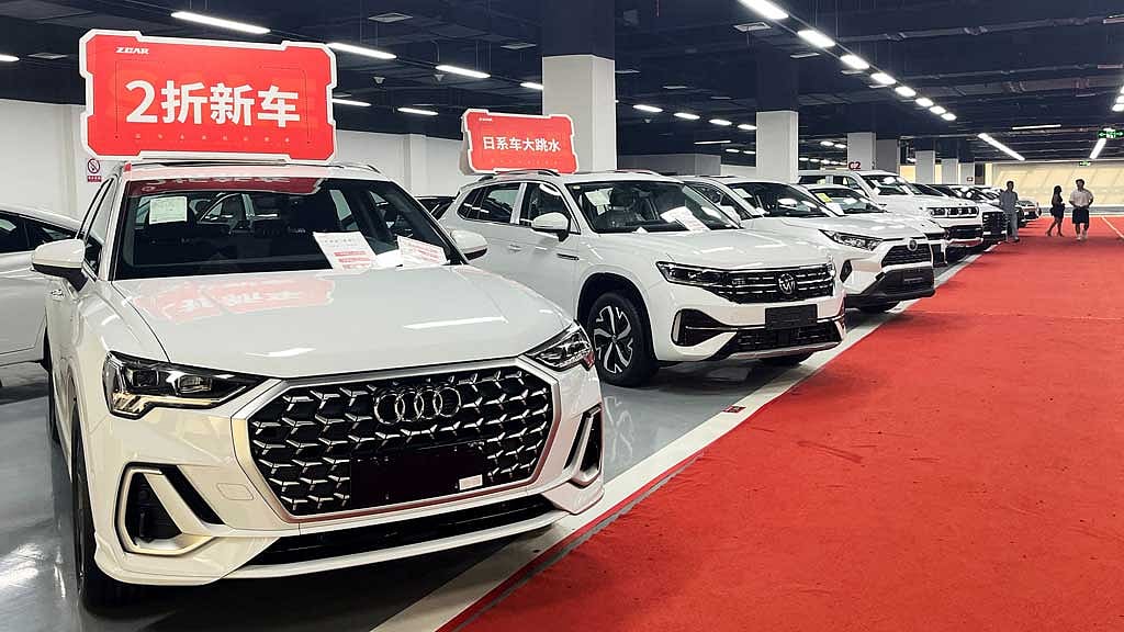 New cars are advertised for sale at deep discounts in the Zcar showroom in Chengdu, China June 6, 2025. REUTERS
