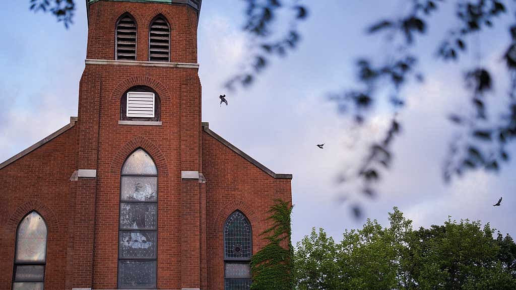 Birds fly next to Lincoln United Methodist Church in Chicago, Illinois, US August 31, 2025. REUTERS