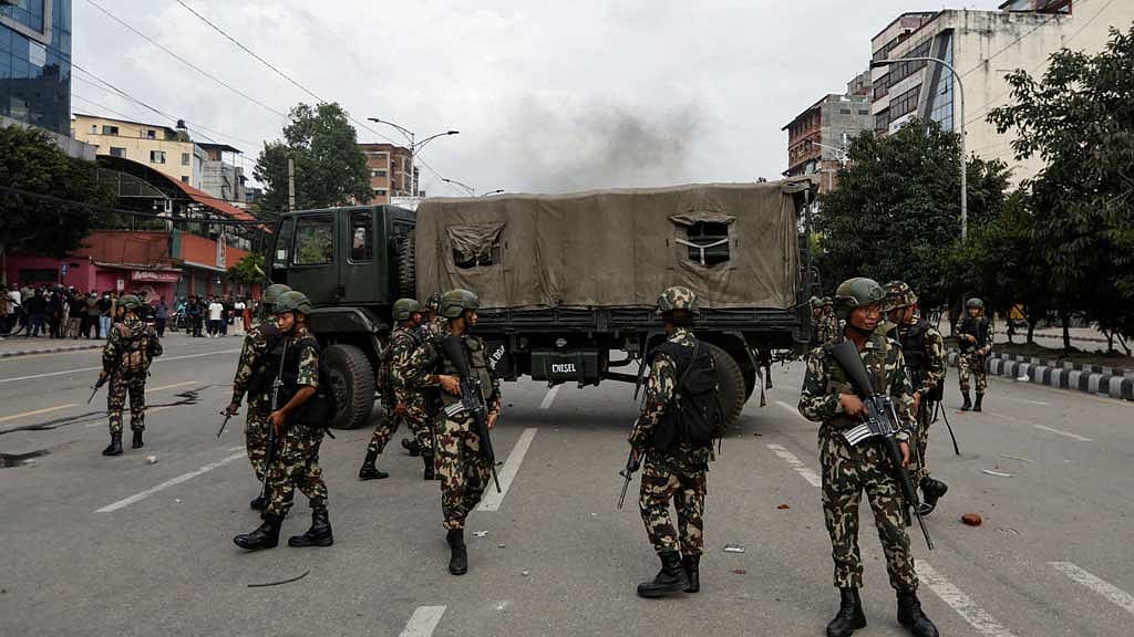 Nepal Army personnel patrol near the parliament following the protest against corruption and the government’s decision to block several social media platforms turned violent, in Kathmandu, Nepal, Sept 8, 2025. REUTERS/Navesh Chitrakar