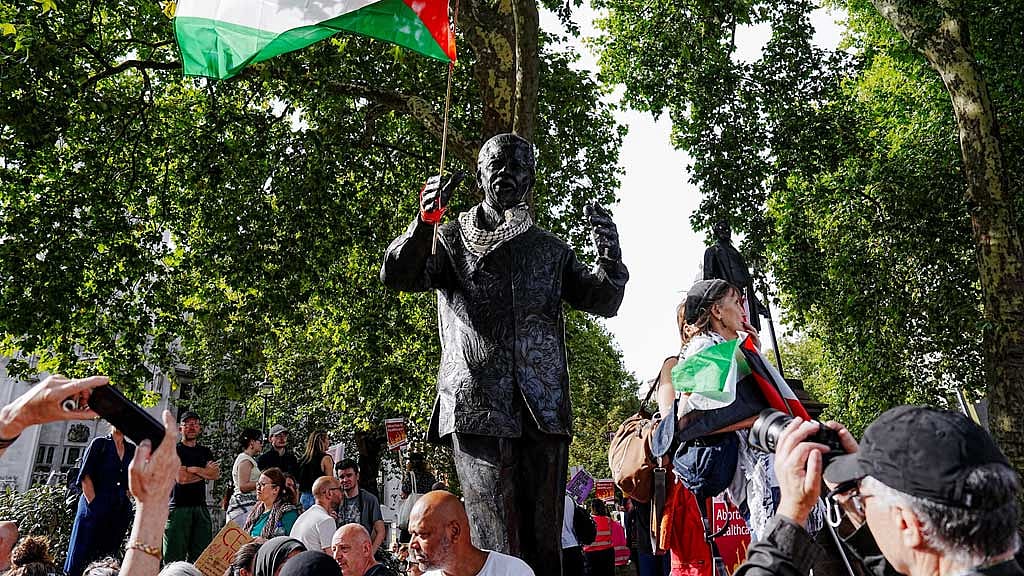 A Palestinian flag is attached to a monument on the day of the "Lift The Ban" rally organised by Defend Our Juries, challenging the British government's proscription of "Palestine Action" under anti-terrorism laws, in Parliament Square, in London, Britain, September 6, 2025. REUTERS