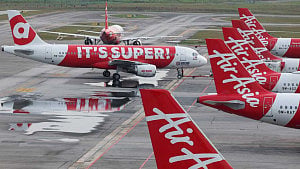 Asian airlines trim schedules, carry extra fuel