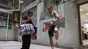 Hong Kong fire victim gathers memories from the ashes