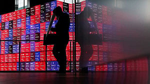 Share futures wobble, dollar gains