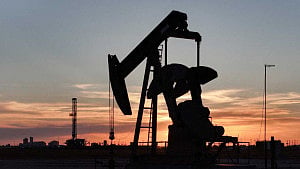 Oil jumps, stock futures slip