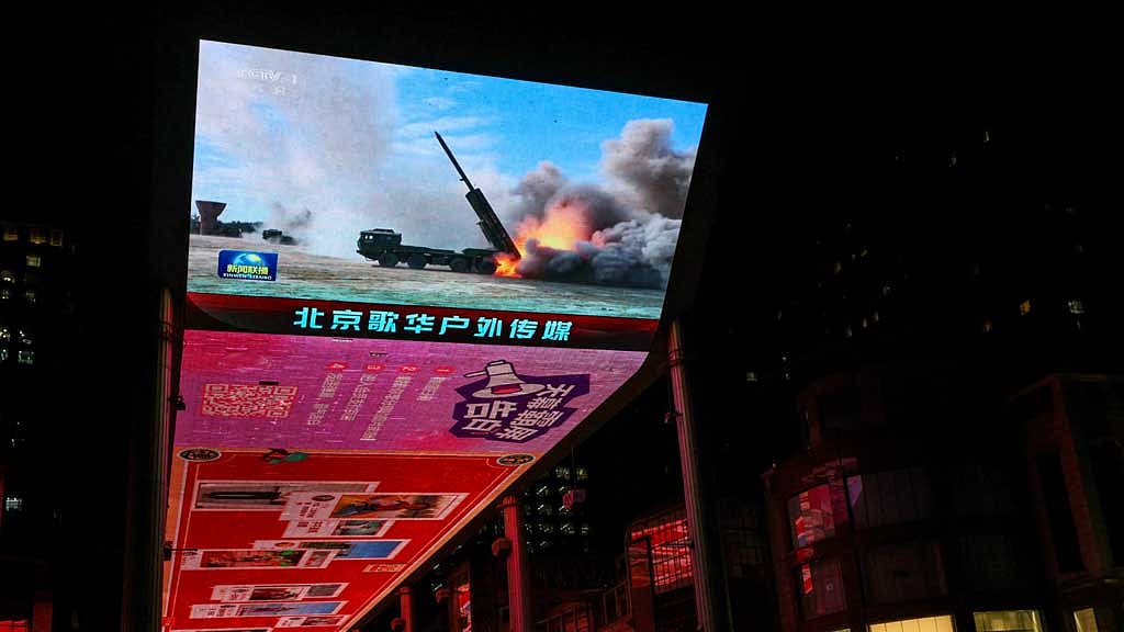 A giant screen shows a news report on China's "Justice Mission 2025" military drills around Taiwan, in Beijing, China December 30, 2025. REUTERS