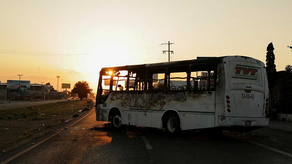 A burnt bus set up as a blockade by members of organized crime following a military operation in which Mexican officials said cartel boss Nemesio Oseguera, "El Mencho," was killed, at a tourist area, in Zapopan, Mexico, Feb 22, 2026. Photo: Reuters
