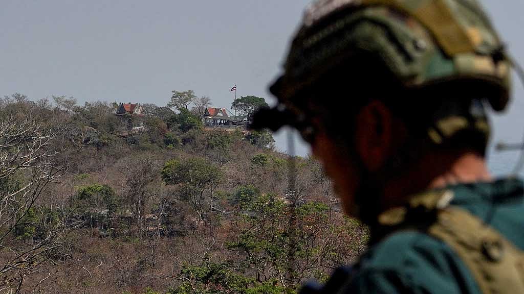 A Thai national flag is seen at the Pha Mo E-Daeng area in Thailand's northeastern Sisaket province, as viewed from Preah Vihear temple in Preah Vihear province, Cambodia, following clashes between the two countries on February 12, 2026. REUTERS/Soveit Yarn