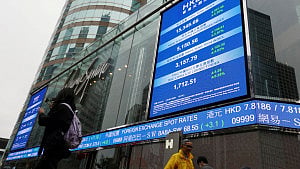 Asian shares slip as earnings loom