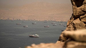 Iran-linked ships rush through Hormuz