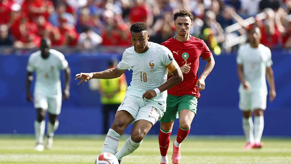 France's Kylian Mbappé battles for the ball with Morocco's Chemsdine Talbi during their FIFA World Cup 2026 quarter-final in Foxborough, Massachusetts. Photo: Reuters