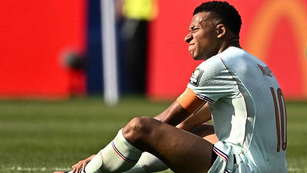 The French captain reacts in pain after a heavy challenge in Foxborough, carrying the weight of a nation’s battle both on and off the pitch at the Boston Stadium, Foxborough, Massachusetts, US on Jul 9, 2026. Credit: REUTERS/Dylan Martinez