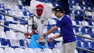 Japan wins on pitch, fans clean up in Monterrey