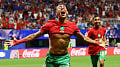 Morocco fight back to advance