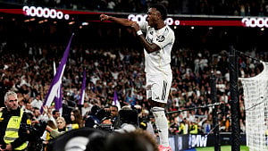 Vinicius double sees Real edge Atleti in pulsating derby
