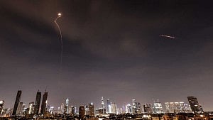 Iran sends waves of missiles into Israel