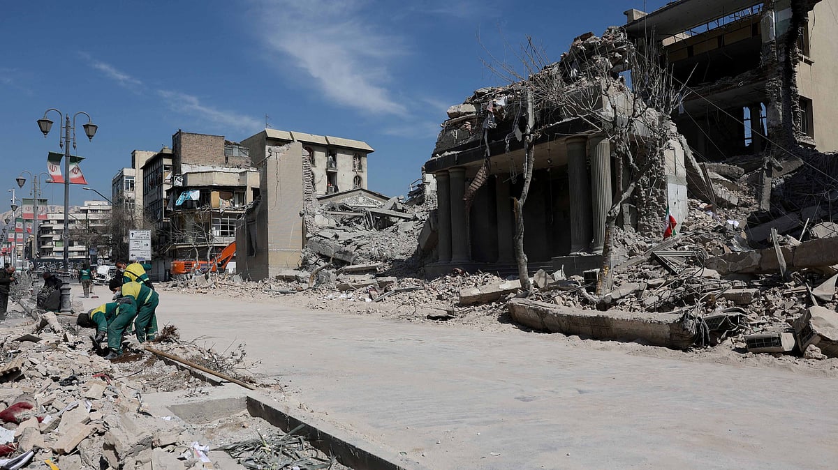 People work near a damaged building following a strike on a police station, amid the US-Israeli conflict with Iran, in Tehran, Iran, Mar 4, 2026. Majid Asgaripour/WANA (West Asia News Agency) via REUTERS