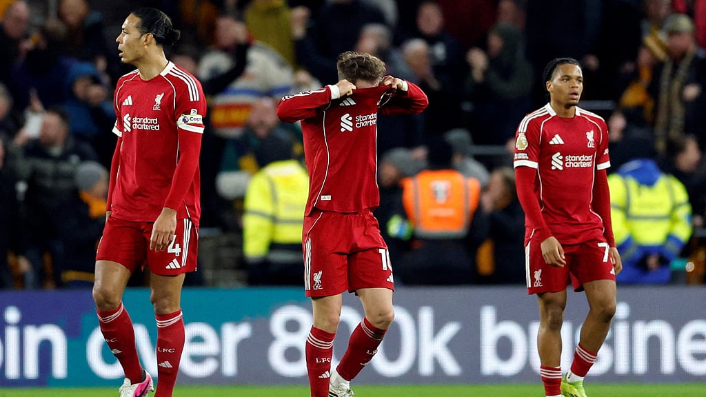 Premier League - Wolverhampton Wanderers v Liverpool - Molineux Stadium, Wolverhampton, Britain - Mar 3, 2026 Liverpool's Alexis Mac Allister, Virgil van Dijk and Rio Ngumoha look dejected after Wolverhampton Wanderers' Andre scores their second goal Action Images via Reuters/Peter Cziborra