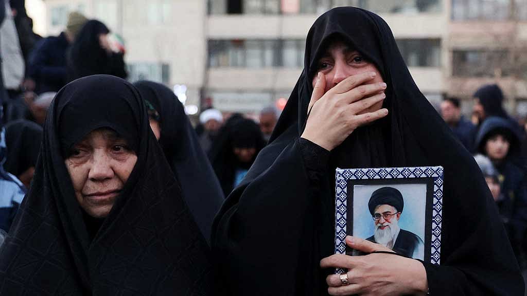 Women react as people gather at the Enghelab Square, after Iran's Supreme Leader Ayatollah Ali Khamenei was killed in Israeli and US strikes on Saturday, in Tehran, Iran, March 1, 2026. Majid Asgaripour/WANA (West Asia News Agency) via REUTERS
