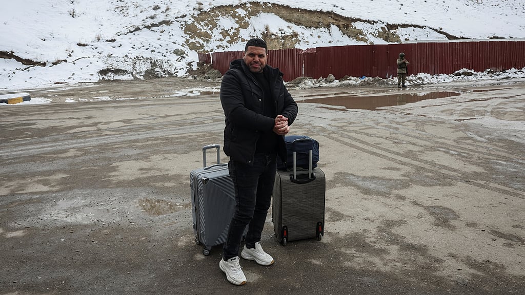 Mohammad Fauzi, 46, after crossing into Turkey from Iran, is seen in Van province, Turkey, Mar 5, 2026. Fauzi, an Egyptian factory worker, crossed into Turkey with no Turkish SIM card, no local currency and no knowledge of Turkish. He had spent three months working in Iran’s marble and granite sector but said many factories had closed as the conflict escalated. REUTERS/Dilara Senkaya 
