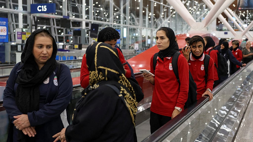 Members of the Iranian women's national soccer team arrive at Terminal 1 of Kuala Lumpur International Airport after attending a match in Group A of the AFC Women's Asian Cup in Australia, at Sepang, Malaysia, Mar 11, 2026. REUTERS/Hasnoor Hussain