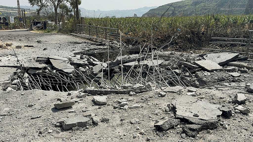 The damaged Qasmiyeh Bridge over the Litani river, after it was hit by an Israeli strike in southern Lebanon on Wednesday, March 18, following an escalation between Hezbollah and Israel amid the US-Israeli conflict with Iran, Lebanon, Mar 19, 2026. Picture taken with a mobile phone. REUTERS