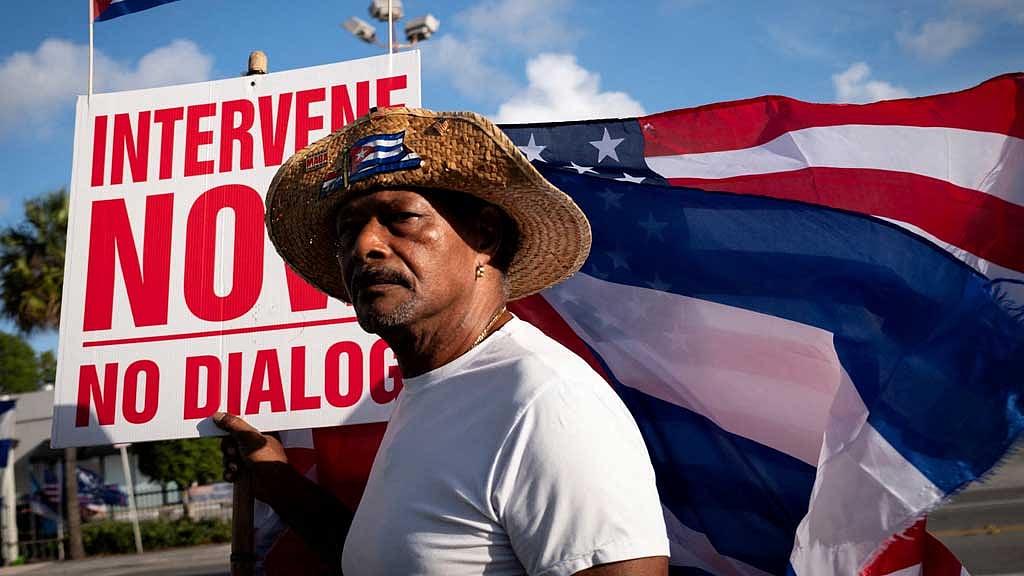 Santiago Ferran poses for a photo during a gathering outside Versailles Cafe after the US Department of Justice announced criminal charges against former Cuban President Raul Castro, in Miami, Florida, US, May 20, 2026. REUTERS/Marco Bello