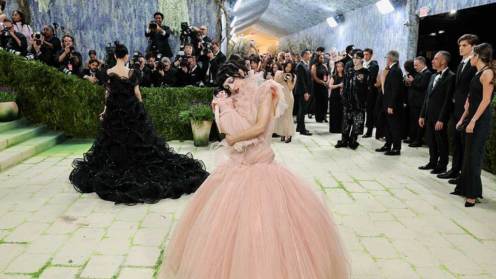 Maria Zardoya carries a doll version of herself during the Met Gala, an annual fundraising gala held for the benefit of the Metropolitan Museum of Art's Costume Institute with this year's theme 'Costume Art' in New York City, New York, US, May 4, 2026. REUTERS/Daniel Cole
