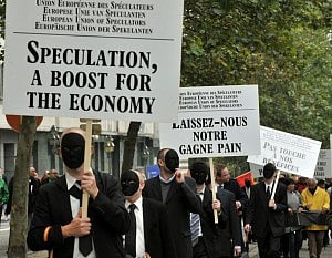 Protesters dressed as bankers and traders take part in an EU-wide demonstration against austerity on September 29, 2010 in Brussels. Placard at the centre reads: "Leave our earnings" and at right: "Don't touch our benefits." 