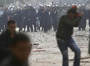 Riot police deployed in central Cairo in attempt to disperse protests. 
