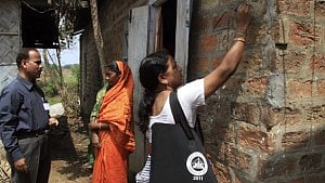 A census official marks a house as her colleague collects details from a from a village resident India. Photo: Reuters A census official marks a house as her colleague collects details from a from a village resident India. Photo: Reuters