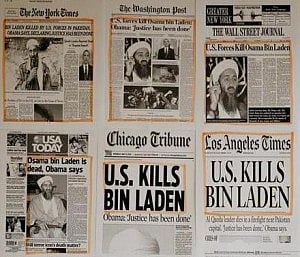 Newspaper headlines and clippings posted on a wall inside a staff office at the White House, May 2, 2011.  Photo: Reuters 