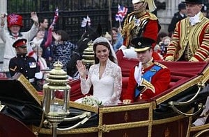 Britain's Prince William and Catherine, Duchess of Cambridge, wave as they travel to Buckingham Palace in the 1902 State Landau along the Procession Route, after their wedding in Westminster Abbey, in central London April 29, 2011. Photo: REUTERS 