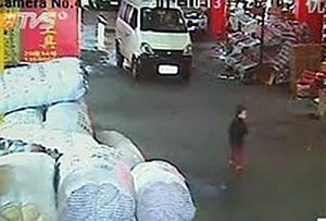 Surveillance video shows a two-year-old Chinese girl run over by a van, which drives off leaving her to bleed on a narrow street. Photo: Reuters   
