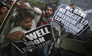 Activists protest outside the residence of India's telecoms and IT minister Kapil Sibal. Photo: Reuters 