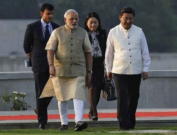 China's President Xi Jinping walks with Prime Minister Narendra Modi during his visit to the Sabarmati river front. Photo: Reuters. China's President Xi Jinping walks with Prime Minister Narendra Modi during his visit to the Sabarmati river front. Photo: Reuters.