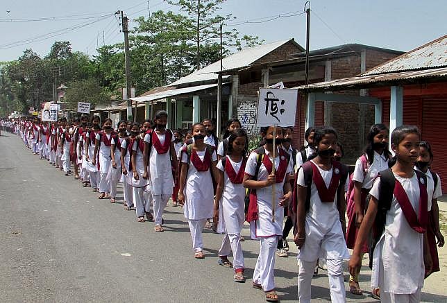 Social awareness of rape and activism: Schoolgirls wear black bands on their faces during a protest rally against the rape case of a 16-year-old girl at Dhupguri town in the eastern Indian state of West Bengal, April 11, 2015. REUTERS/STRINGER 