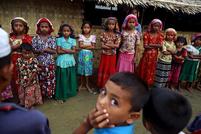 Children attend a class on the Koran conducted by a Rohingya Muslim religious teacher at a refugee camp outside Sittwe, Myanmar. REUTERS/SOE ZEYA TUN 