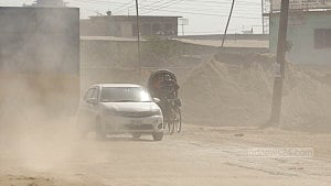 Dust blankets Dhaka roads