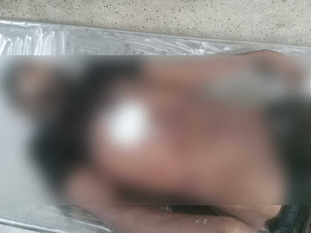 সাদ্দাম হোসেন সনুর মৃতদেহ।