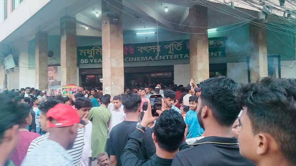 People stand in a long queue at Modhumita Cinema Hall. Photo: Collected.
