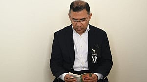 Tarique recites Quran beside Khaleda's coffin
