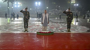 In the first hour of Ekushey, floral tributes adorn Shaheed Minar