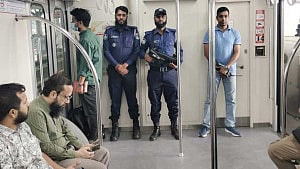 MRT policemen patrol trains for passenger safety