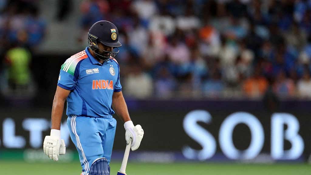 ICC Men's Champions Trophy - Final - India v New Zealand - Dubai International Stadium, Dubai, United Arab Emirates - March 9, 2025 India's Rohit Sharma walks back to the pavilion after losing his wicket, stumped out by New Zealand's Tom Latham off the bowling of Rachin Ravindra REUTERS/Satish Kumar