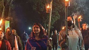 Torchlight march in ‘solidarity’ with JU teacher